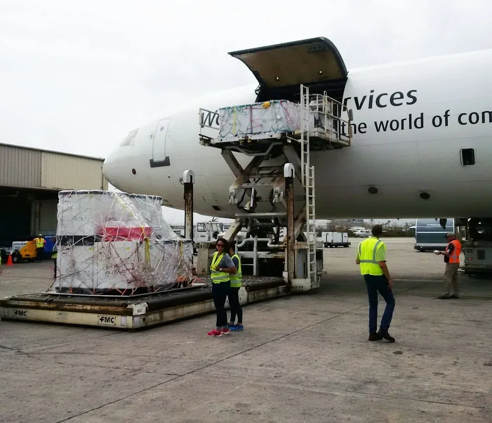 Cargo aircraft being loaded with freight pallets